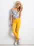 Фото #4 товара Женские джинсы скинни со средней посадкой укороченные рваные желтые  Factory Price